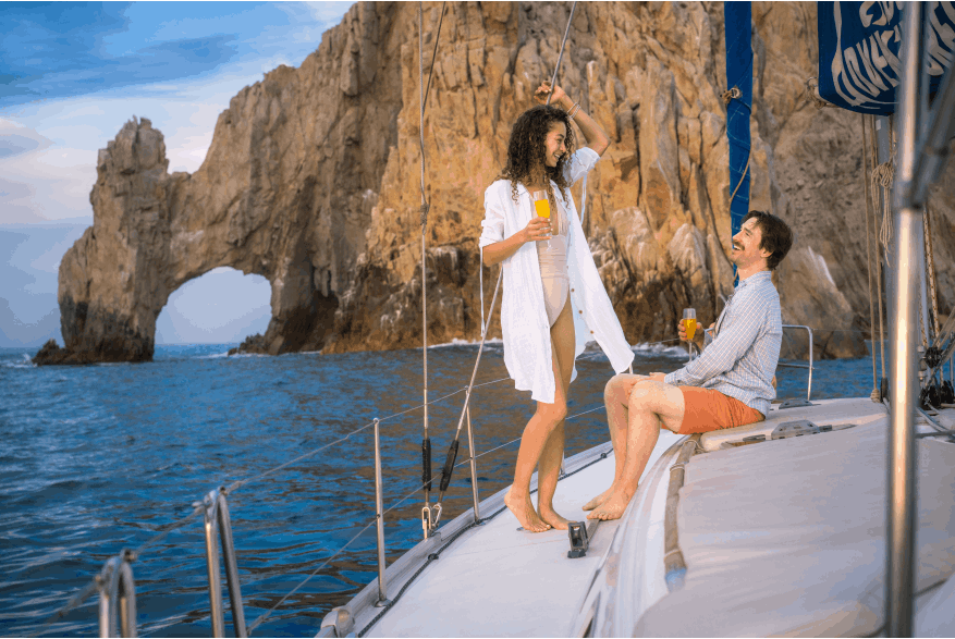 Couple on a boat at the Los Cabos arch